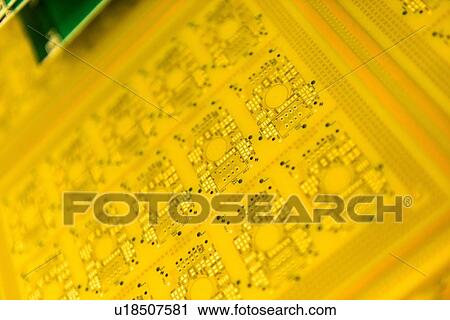 Stock Image - Circuit board detail in circuit board factory. Fotosearch