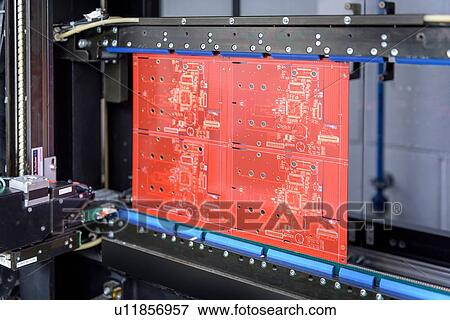 Stock Photo - Circuit board in testing machine in circuit board factory. Fotosearch