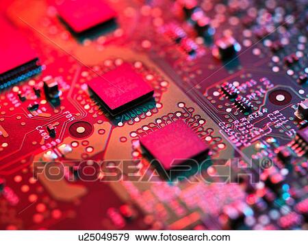 Stock Photo - Close up detail of pink computer circuit board. Fotosearch