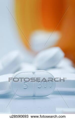 Close up of oval white pill, Vicodin View Large Photo Image Stock Image - Close up of oval white pill, Vicodin. Fotosearch