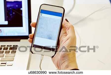 Close up of womans hand holding smartphone with blank screen View Large Photo Image Stock Image - Close up of womans hand holding smartphone with blank screen. Fotosearch