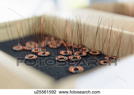 Stock Image - Electromagnets on production line in electromagnetics factory. Fotosearch