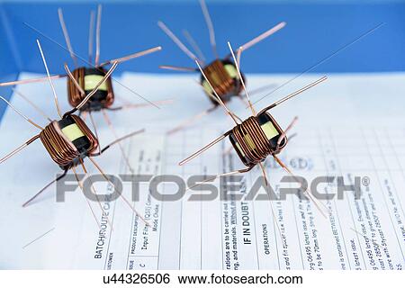 Electromagnets on production line in electromagnetics factory, close-up View Large Photo Image Stock Photograph - Electromagnets on production line in electromagnetics factory, close-up. Fotosearch