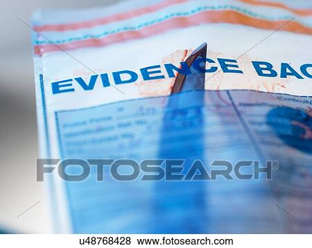 Stock Photo - Evidence from knife crime incident in forensic bag. Fotosearch