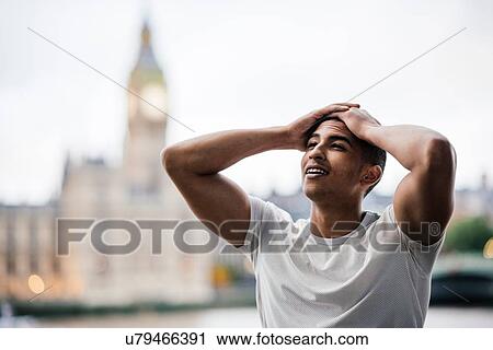 Exhausted male runner taking a break on Southbank, London, UK View Large Photo Image Stock Image - Exhausted male runner taking a break on Southbank, London, UK. Fotosearch