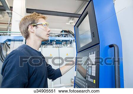 Factory technician monitoring control panel View Large Photo Image Stock Image - Factory technician monitoring control panel. Fotosearch