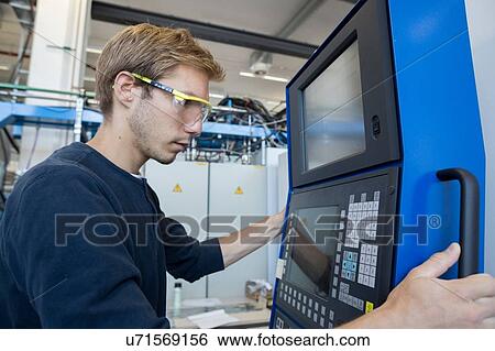 Factory technician working on control panel View Large Photo Image Stock Photograph - Factory technician working on control panel. Fotosearch