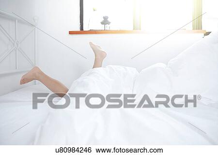Feet sticking out of bed View Large Photo Image Stock Photograph - Feet sticking out of bed. Fotosearch