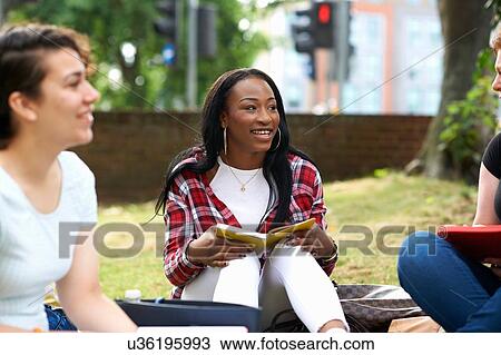 Female students chatting on college campus View Large Photo Image Stock Image - Female students chatting on college campus. Fotosearch