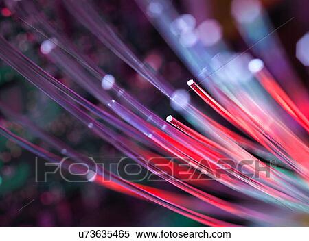 Stock Photography - Fibre optics used to send data darting past computer circuit board. Fotosearch