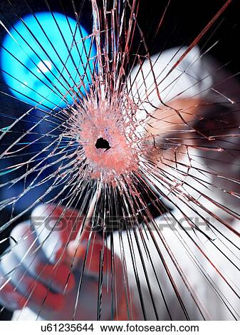 Picture - Forensics officer using swab to collect evidence from broken window. Fotosearch