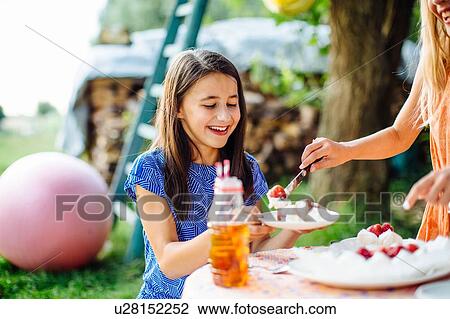 Girl at summer garden party View Large Photo Image Stock Image - Girl at summer garden party. Fotosearch