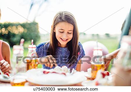 Girl at summer garden party View Large Photo Image Stock Image - Girl at summer garden party. Fotosearch