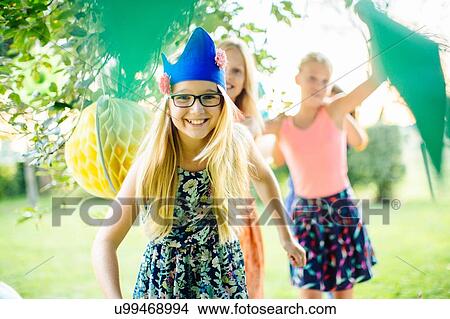 Girls dancing at summer garden party View Large Photo Image Picture - Girls dancing at summer garden party. Fotosearch