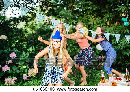 Girls dancing at summer garden party View Large Photo Image Stock Image - Girls dancing at summer garden party. Fotosearch