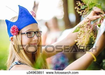 Girls decorating garden for summer party View Large Photo Image Stock Image - Girls decorating garden for summer party. Fotosearch