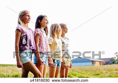 Girls enjoying view in field, Flanders, Belgium View Large Photo Image Stock Image - Girls enjoying view in field, Flanders, Belgium. Fotosearch