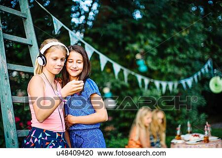 Girls having fun at summer garden party View Large Photo Image Stock Image - Girls having fun at summer garden party. Fotosearch
