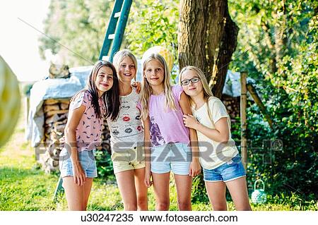 Girls together at garden party View Large Photo Image Stock Photography - Girls together at garden party. Fotosearch