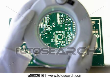 Green circuit board under inspection magnifier in circuit board factory View Large Photo Image Stock Image - Green circuit board under inspection magnifier in circuit board factory. Fotosearch