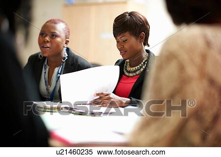 Group of students working together in class View Large Photo Image Stock Photography - Group of students working together in class. Fotosearch