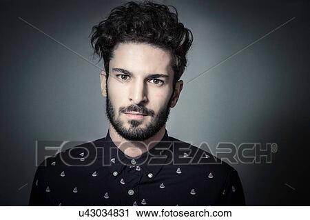 Head and shoulder studio portrait of bearded young man View Large Photo Image Stock Image - Head and shoulder studio portrait of bearded young man. Fotosearch