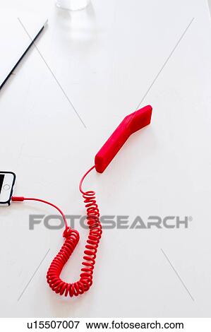 High angle view of red handset attached to smartphone View Large Photo Image Stock Photo - High angle view of red handset attached to smartphone. Fotosearch