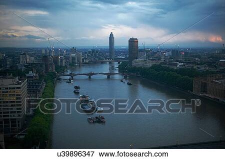 Stock Photo - High angle view of river Thames at dawn, London, England, UK. Fotosearch
