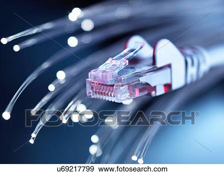 Stock Photo - Internet network connector with fibre optics, close-up. Fotosearch