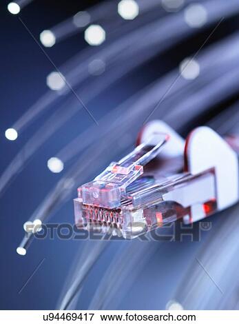 Stock Photo - Internet network connector with fibre optics, close-up. Fotosearch