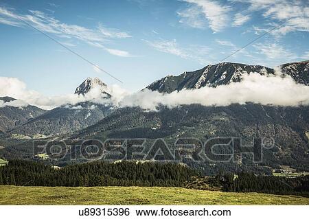 Stock Photograph - Landscape of mountains and low cloud, Achenkirch, Austria. Fotosearch
