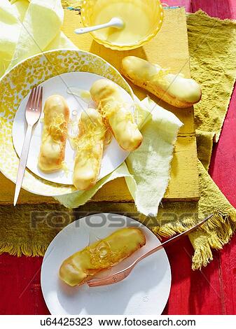 Lemon Curd Eclairs Profiteroles View Large Photo Image Stock Image - Lemon Curd Eclairs Profiteroles. Fotosearch