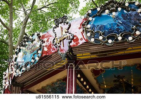 Stock Photography - Low angle detail of ornate carousel. Fotosearch