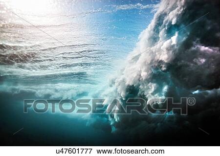 Low angle underwater view of huge wave crashing over a shallow reef View Large Photo Image Stock Photo - Low angle underwater view of huge wave crashing over a shallow reef. Fotosearch