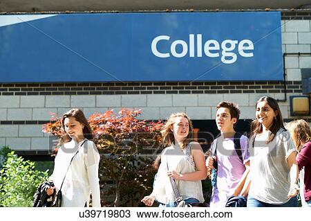 Male and female students strolling on college campus View Large Photo Image Stock Image - Male and female students strolling on college campus. Fotosearch