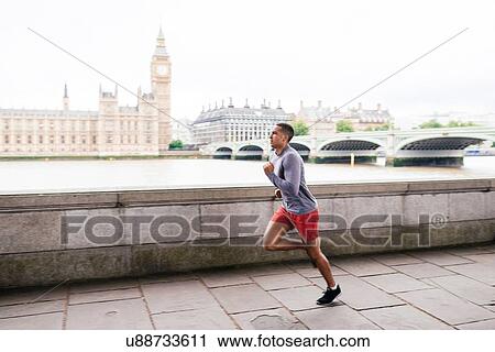 Male runner running on Southbank, London, UK View Large Photo Image Stock Image - Male runner running on Southbank, London, UK. Fotosearch