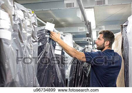 Male warehouse worker stock taking in distribution warehouse View Large Photo Image Stock Photo - Male warehouse worker stock taking in distribution warehouse. Fotosearch