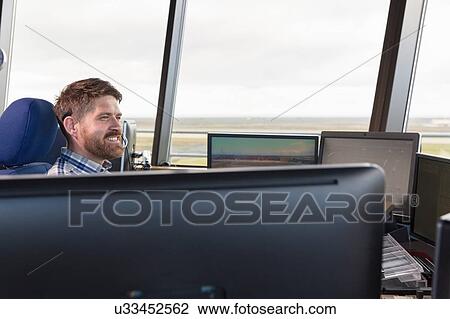 Man at work in air traffic control tower View Large Photo Image Stock Image - Man at work in air traffic control tower. Fotosearch