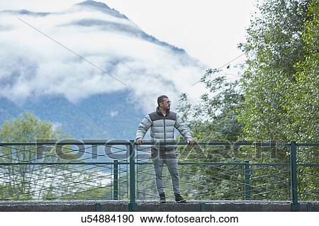 Stock Image - Man enjoying solitude, Valle de Aran, Spain. Fotosearch