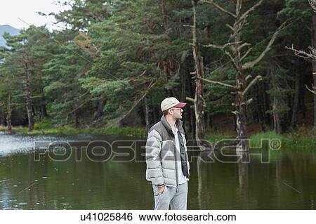 Stock Photograph - Man enjoying solitude, Valle de Aran, Spain. Fotosearch