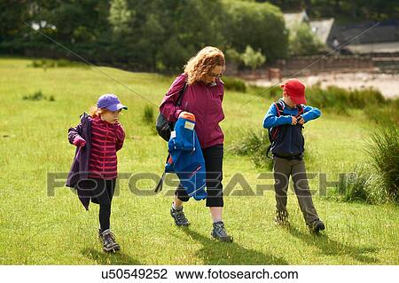 Mother and children, walking, Lake District, Cumbria, UK View Large Photo Image Stock Image - Mother and children, walking, Lake District, Cumbria, UK. Fotosearch