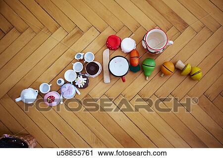 Overhead view of cupcakes, toys and cups on parquet floor View Large Photo Image Stock Image - Overhead view of cupcakes, toys and cups on parquet floor. Fotosearch