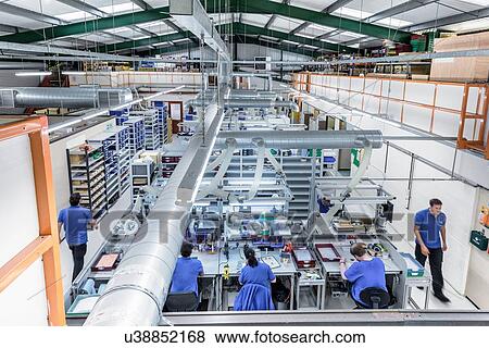 Overview of production line in electronics factory View Large Photo Image Stock Photo - Overview of production line in electronics factory. Fotosearch