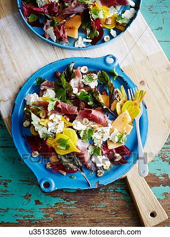 Plate of duck prosciutto salad on chopping board View Large Photo Image Stock Photography - Plate of duck prosciutto salad on chopping board. Fotosearch