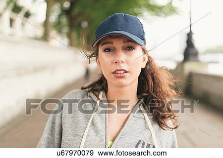 Portrait of female runner wearing baseball cap View Large Photo Image Stock Photo - Portrait of female runner wearing baseball cap. Fotosearch
