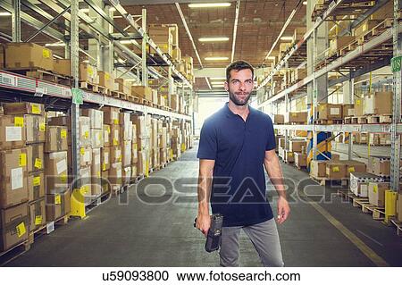 Portrait of male warehouse worker standing in distribution warehouse aisle View Large Photo Image Stock Image - Portrait of male warehouse worker standing in distribution warehouse aisle. Fotosearch