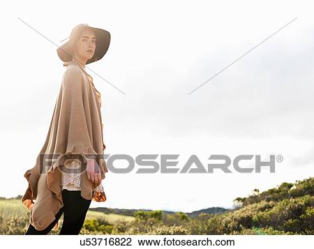 Portrait of stylish young woman wearing felt hat and shawl, Point Addis, Anglesea, Victoria, Australia View Large Photo Image Stock Image - Portrait of stylish young woman wearing felt hat and shawl, Point Addis, Anglesea, Victoria, Australia. Fotosearch