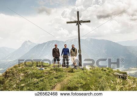 Stock Photo - Portrait of three mature male hikers on mountain, Achenkirch, Austria. Fotosearch