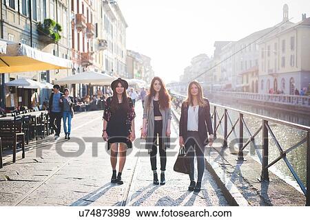 Portrait of three young stylish women on canal waterfront View Large Photo Image Stock Photo - Portrait of three young stylish women on canal waterfront. Fotosearch