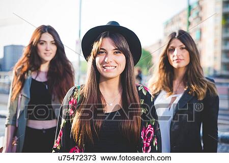Portrait of three young women in city View Large Photo Image Stock Image - Portrait of three young women in city. Fotosearch